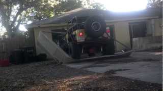 Crazy garage door removal - jeep wrangler driving through v8 lifted