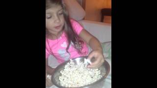 Kids eating popcorn with their feet.