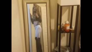 Crossdresser in tight white yogapants and thigh high over the knee boots
