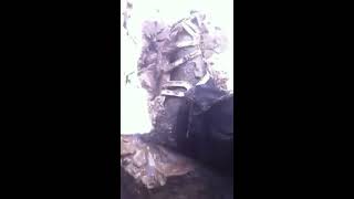 silver sandals and jeans in mud