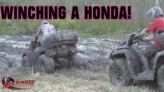 CAN-AM OUTLANDER WINCHING A HONDA RINCON! GOOD TIMES IN THE MUD!