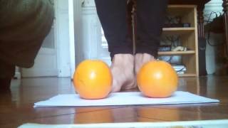 Lady beautiful feet trampling fruits