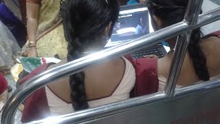 Two School Girls Watching Movie in Train