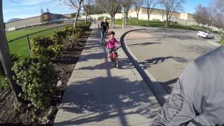 Mia Biking with Mom and Dad Scooting 1/29/17