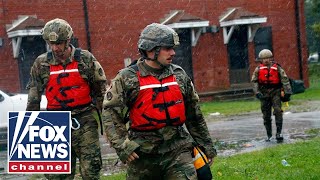 First responders work to rescue people trapped by Florence