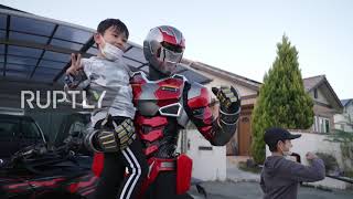 Robot chicken! Local hero delivers grilled chicken to children in robo-suit