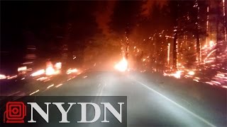 Car drives through California wildfire