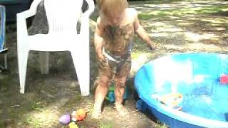 Dominic has discovered how to make a mud puddle