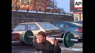 RUSSIA: MOSCOW: WEIGHTLIFTER BREAKS WORLD RECORD
