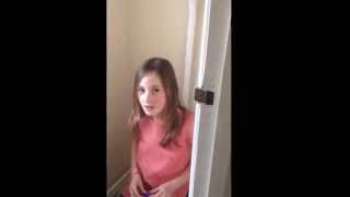 Funny English girl singing sitting on the toilet
