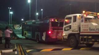 Bus being removed from tennis court in Yio Chu Kang