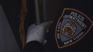 Amid Tensions, Mourning Heroic Officers