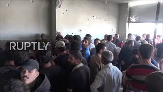 Syria: Dozens flock to surrender weapons at amnesty point in Daraa