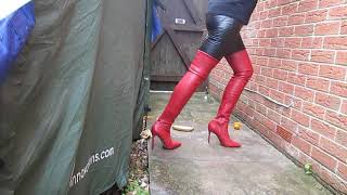 Husband and Wife identical stiletto thigh boots and leggings crushing fruit