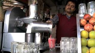Pomegranate juice being sold on an Indian street corner
