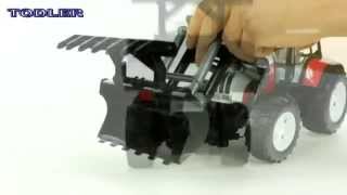 Трактор Steyr CVT 170 с ковшом и прицепом с бревнами Bruder 02-088