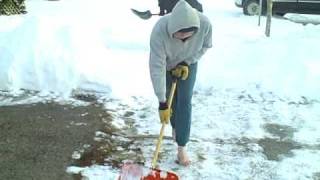 Barefoot Walker shoveling snow barefoot on 01/10/2009 and talking with two passersby