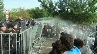 Raw: Hungarian Police Use Tear Gas On Migrants