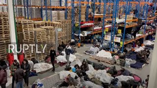 Belarus: Stranded migrants settle in at logistics centre in Bruzgi