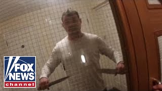 Man armed with kitchen knives attacks police officers