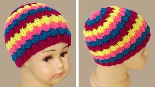 Вязание шапки резинкой. Шапка спицами резинкой.  Knitting cap.