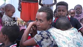 Sudan: Ethiopians living in Abu Zarad refugee tent camp do daily chores in open air as war continues
