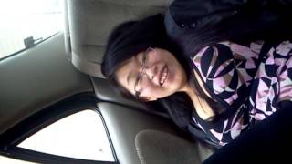 Tickling wife's feet in the car.