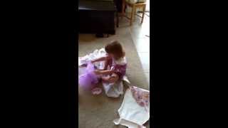 Putting on her tutu.