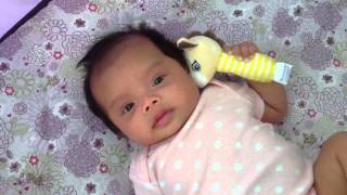 Elina holds her toy