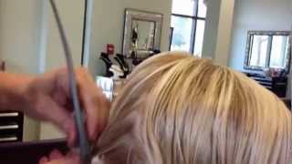 Blonde asymetric haircut by Stephanie