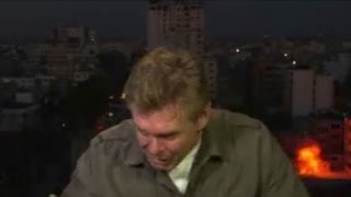 Watch: CNN reporter takes cover after blast