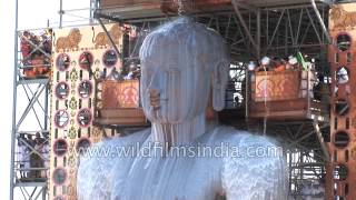 Jain devotees pour milk over the monolithic statue of Bahubali : Mahamastakabhishek, Karnataka