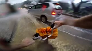 Bicycling on Flooded Roads: Tropical Rain in Kuala Lumpur