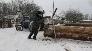 Подъем бревен трактором