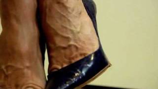Veiny feet in Silver heels crushing bushing