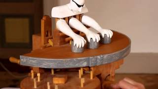 Three Armed Wooden Robot Shell Game