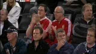 Mike Phillips blasts through the Sharks