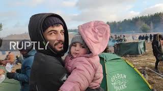 Belarus: Migrants stranded at border line up for food and bedding in Bruzgi