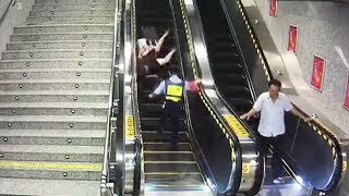 Policewoman dashes to save elderly lady tumbling down from an escalator