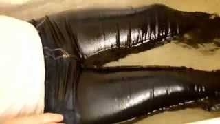Wearing tight jeggings in bathtub and slapping butt