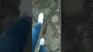 Girl in Adidas Superstars trampling in mud