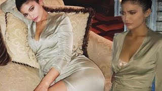 Kylie Jenner flashes white bra after slipping into a low-cut slinky dress