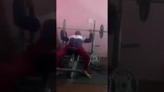 Sikh boy lifting weights.