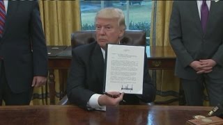 VIDEO: Trump signs memo to leave TPP trade pact