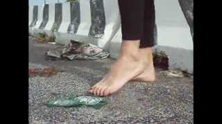 Violacea barefoot on broken glass