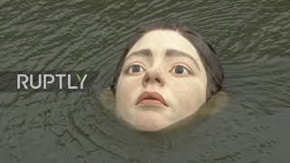 Drowning girl statue in Spain"s Bilbao makes locals stop and stare