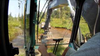 Excavator Busting Beaver Dams