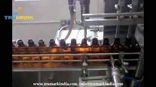 Automatic syrup BOTTLE filling capping labeling machine, exporter of pharma liquid filling line