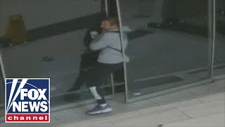 Raw video shows burglar getting stuck in sliding door