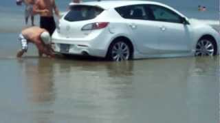 Jacksonville Fl: Car stuck in water by the incoming tide.
